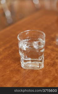 glass of clear water on the tabble in cafe