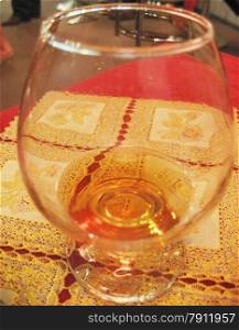 Glass of cognac still on the table in restaurant