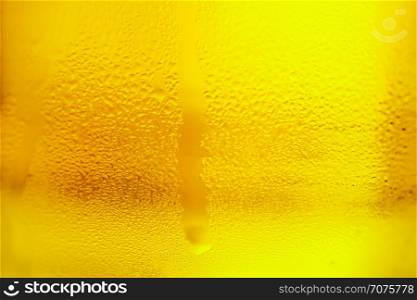 glass of cold beer. misted glass of cold drink, close-up