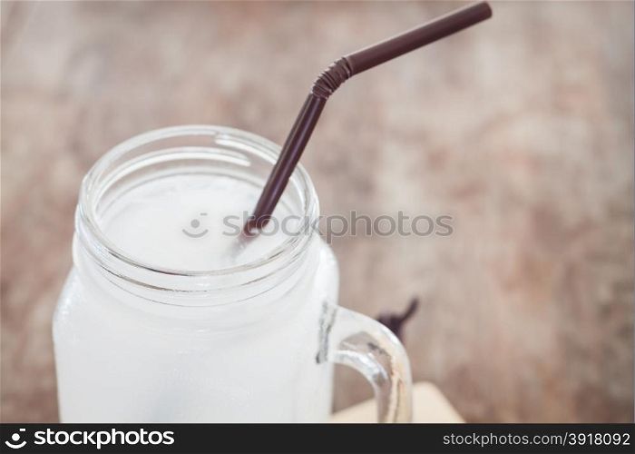 Glass of fresh coconut water, stock photo