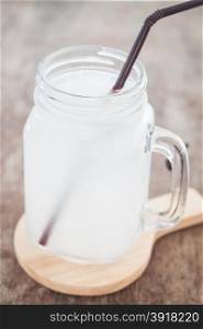 Glass of fresh coconut water, stock photo
