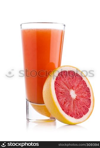 Glass of fresh grapefruit juice with fruit on white background