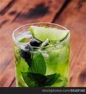 glass of fresh Mojito on wooden