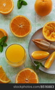 Glass of fresh orange juice with fresh fruits