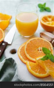 Glass of fresh orange juice with fresh fruits