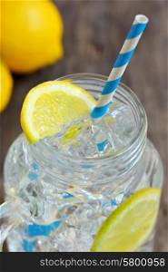 Glass of fresh water with lemon