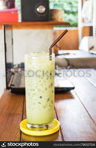 Glass of iced green tea latte, stock photo