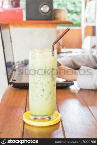 Glass of iced green tea latte, stock photo