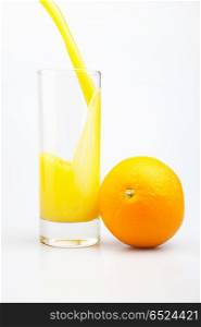 Glass of juice and orange on a white background. Orange juice