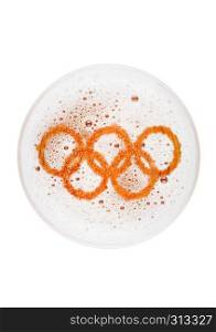 Glass of lager ale beer top with olympics shape on white background top view