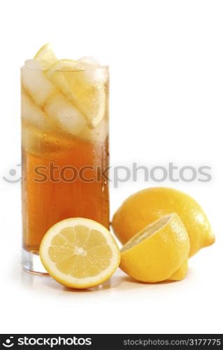 Glass of lemon cold iced tea with lemons on white background