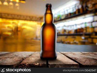 Glass of light beer on a dark pub.. Beer in dark pub