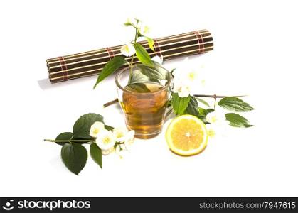 glass of lime tea with a lemon at a rug