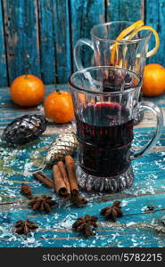 glass of mulled glass of mulled wine with spices in retro style wine