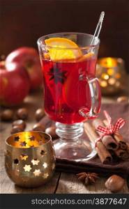 glass of mulled wine with orange and spices