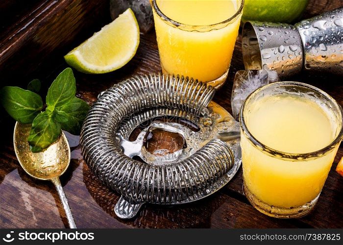 Glass of orange drink.Alcoholic drinks on rustic wood background.Drink background. Fresh cocktail drinks
