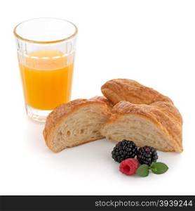 Glass of orange juice, fresh croissant , raspberries and blackberries on white background