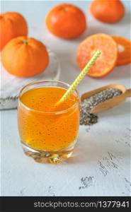 Glass of orange juice with basil seeds