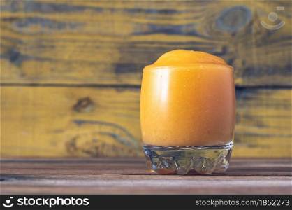 Glass of Papaya Caliente - fruity rum cocktail