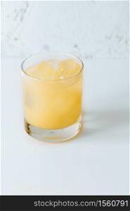 Glass of Penicillin cocktail on white background