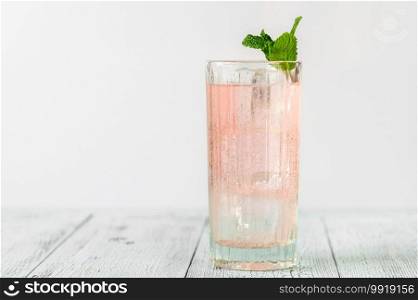Glass of pink gin and tonic cocktail