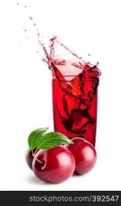 Glass of plum juice with splash and berries isolated on white background. Glass of plum juice with splash and berries