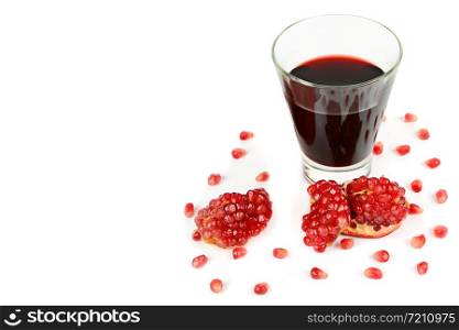 Glass of pomegranate juice with fruit isolated on white. Healthy food. Free space for text.