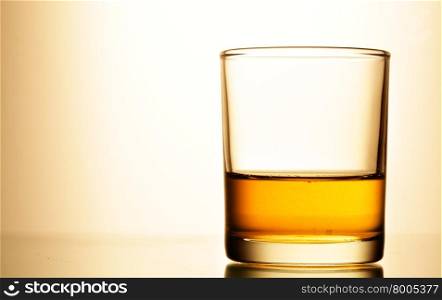 Glass of pure whisky close up