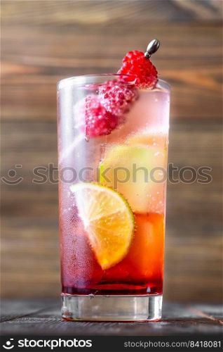 Glass of Raspberry lime rickey cocktail garnished with fresh berries
