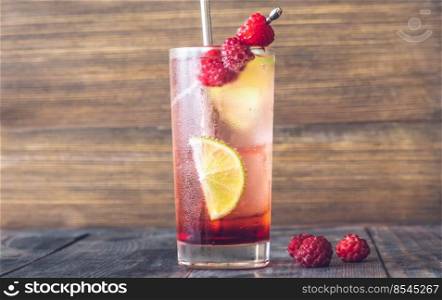 Glass of Raspberry lime rickey cocktail garnished with fresh berries