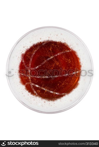 Glass of red ale beer top with basketball shape on white background top view