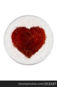Glass of red ale beer top with heart shape on white background top view