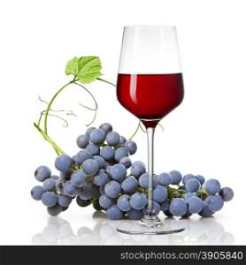 Glass of red wine and grape isolated on white