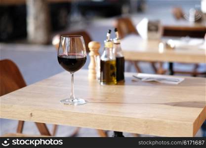 Glass of red wine in outdoor restaurant