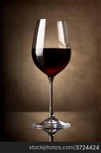 Glass of red wine on a dark background