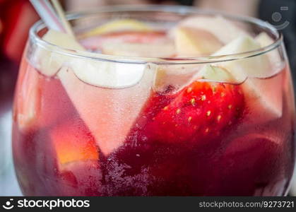 Glass of sangria decorated with fresh fruit. Sangria is a typical Spanish alcoholic beverage. Traditionally, it consists of red wine and chopped fruit, often with other ingredients or spirits