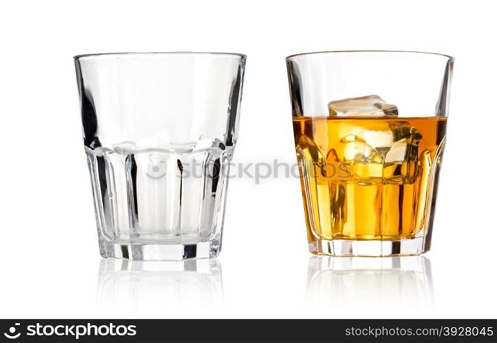 Glass of scotch whiskey and emty glass on a white background
