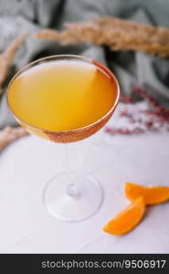 Glass of sidecar orange cocktail closeup