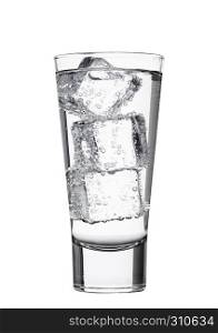 Glass of sparkling mineral water with ice cubes on white background