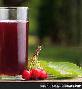 Glass of stewed sweet cherry fruit