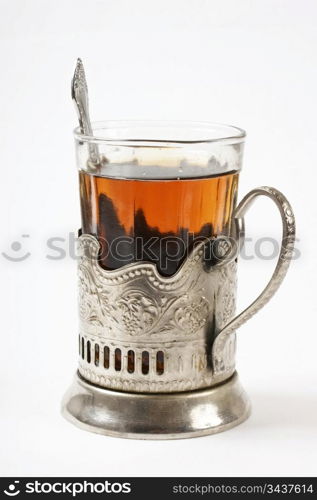 glass of tea in a silver cup