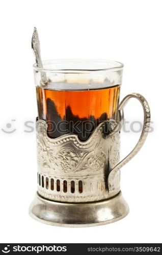 glass of tea in a silver cup isolated on white background
