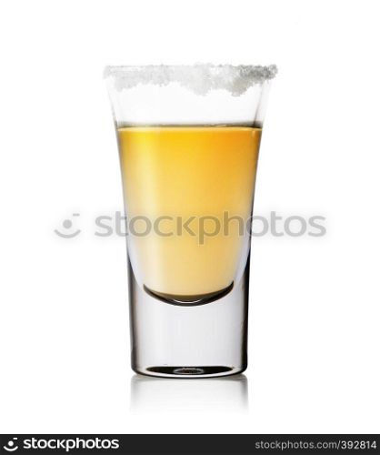 Glass of tequila with salt on the rim isolated on white background. Gold tequila. Traditional strong alcoholic Mexican drink.. Glass of tequila with salt on the rim