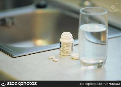 glass of water and tablets