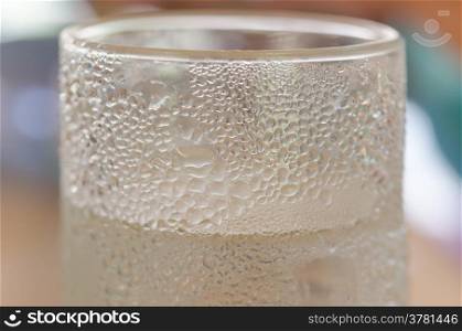 glass of water. close up view of the glass ice cubes and water