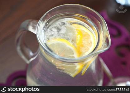 glass of water lemon cold fresh lemonade with ice