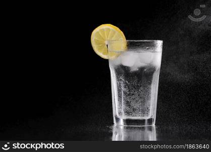 Glass of water with a lemon