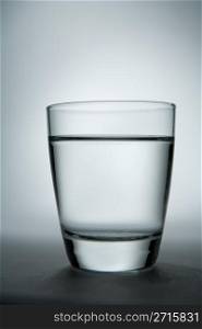 Glass of water with gradient background