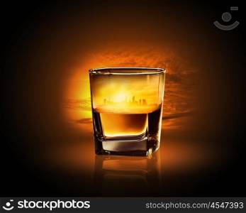 Glass of whiskey. Glass of whiskey with city illustration in it