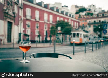 Glass of wine at the street cafe table